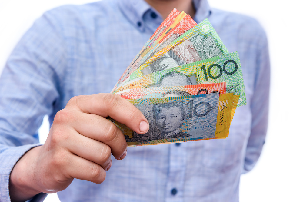 Man holding Australian currency